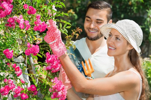 Professional gardener preparing tools at a Paddington garden entrance
